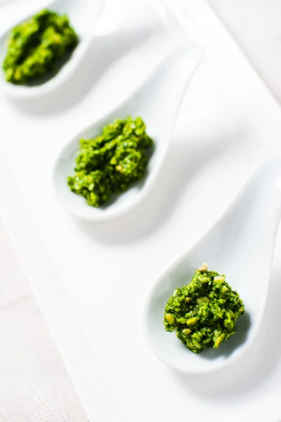 Kale Pesto sauce on white tasting spoon — Stock Photo, Image