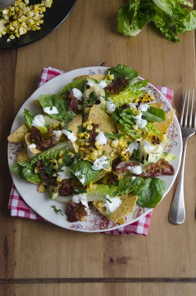 Nachos with bacon and lettuce — Stock Photo, Image