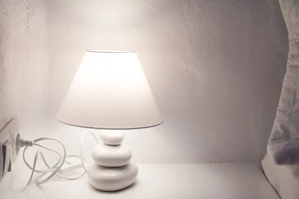 Close Burning Lamp Nightstand White Stone Wall — Stock Photo, Image