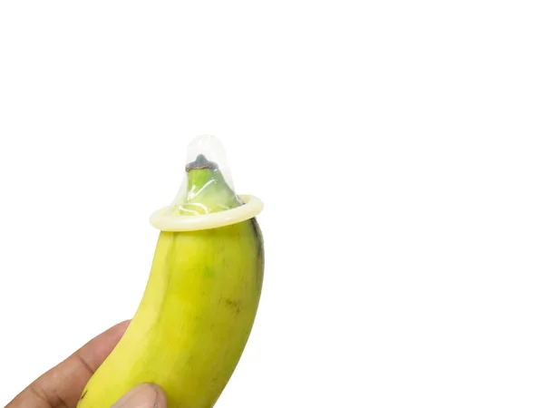 Mano Sosteniendo Plátano Con Condón Parte Superior Fondo Blanco Seguro — Foto de Stock