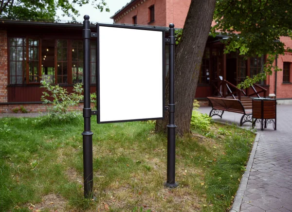 Blank street billboard concept. Advertising billboard in summer with white field for advertising