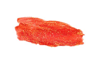 Kırmızı boya lekesi. Altın konfeti kırıntılarıyla boyanmış bir leke..