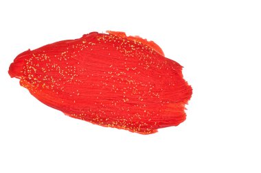 Kırmızı boya lekesi. Altın konfeti kırıntılarıyla boyanmış bir leke..