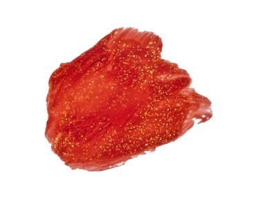 Kırmızı boya lekesi. Altın konfeti kırıntılarıyla boyanmış bir leke..