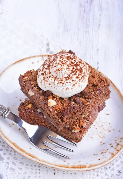 Chocolate cake with nuts and whipped cream Stok Resim