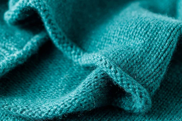 Blue green luxury pure cashmere texture. Blurred background with copy space