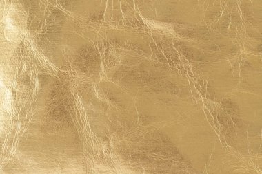 Kopyalanmış altın rengi folyo deri dokusu kopya alanı ile arka plan