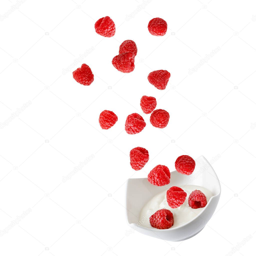 Fresh raspberries falling into bowl  with yogurt isolated on white background