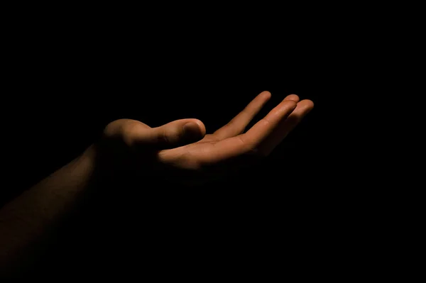 Hand in het donker — Stockfoto