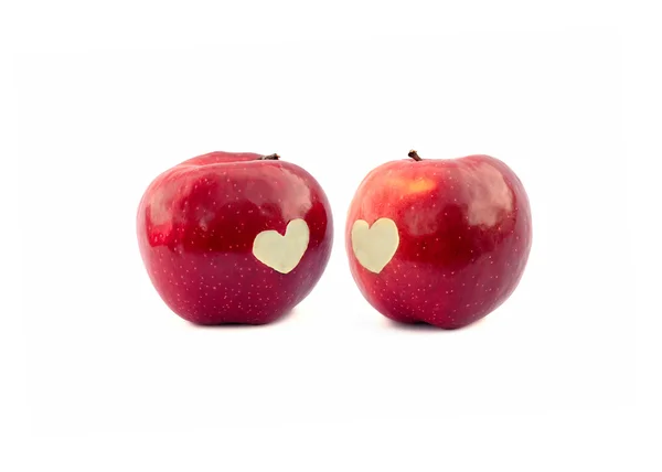 Dwa jabłka z serce symbol — Zdjęcie stockowe