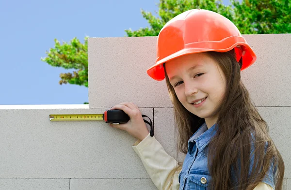 Child in a protective construction helmet — Stock Photo, Image