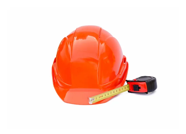 Casque de construction protectrice et roulette l'isolé — Photo