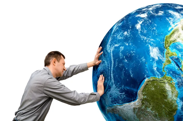 El hombre empuja el planeta sobre un fondo blanco. Elementos de esta i Fotos De Stock