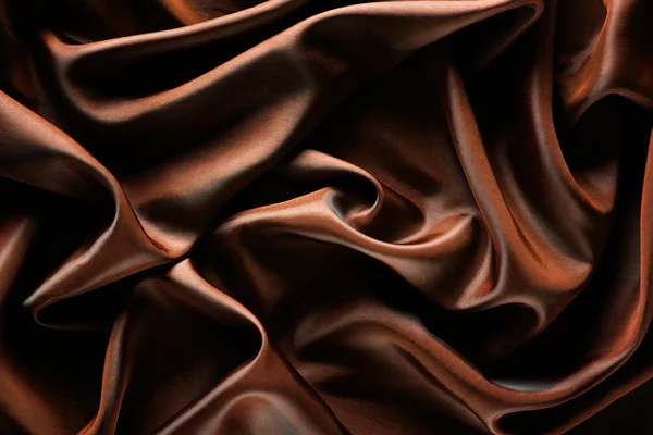 Abstrakt wave textil textur eller bakgrund i gyllene brun colo — Stockfoto