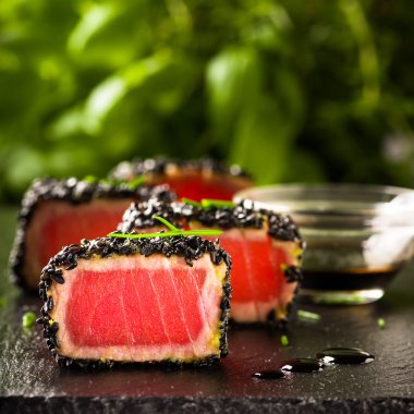 Fried tuna steak in black sesame clipart