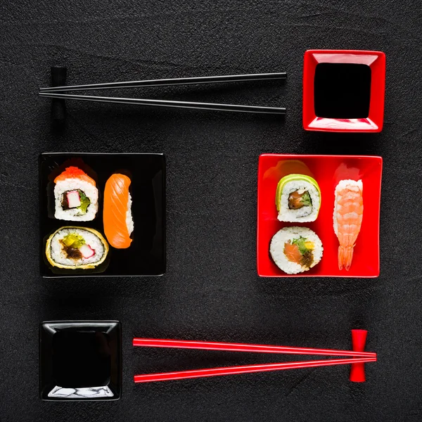 Sushi set on black stone table top view