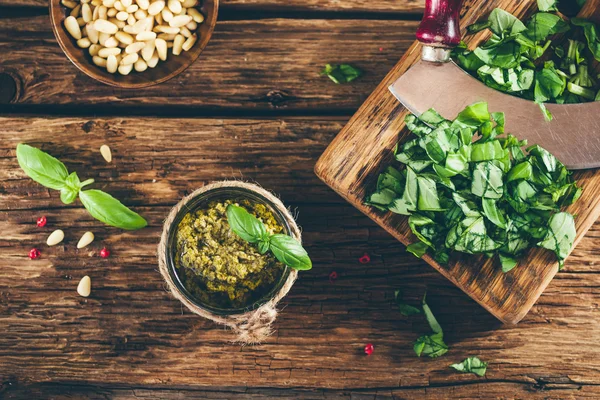 Pesto sauce and ingredients on old wooden table, vintage style — Stock Photo, Image