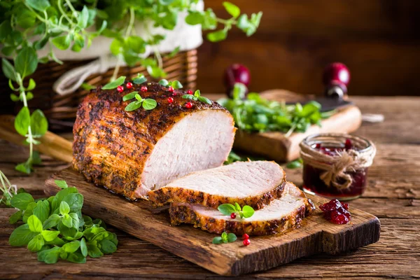 Roasted pork loin with cranberry and marjoram — Stock Photo, Image