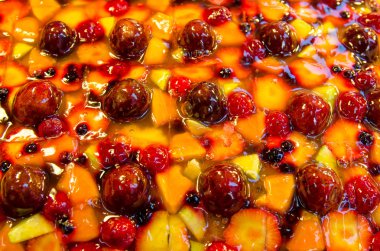 Top view of fruit cake with strawberry,peach,blueberry and other fruits.