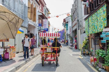 People can seen walking and exploring around the street art in Georgetown, Penang