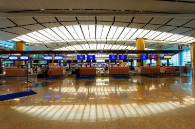 Check in counters at Changi International Airport which is located in Singapore. clipart