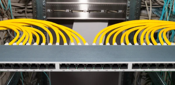 Network distributor in a datacenter with LAN cables — Stock Photo, Image