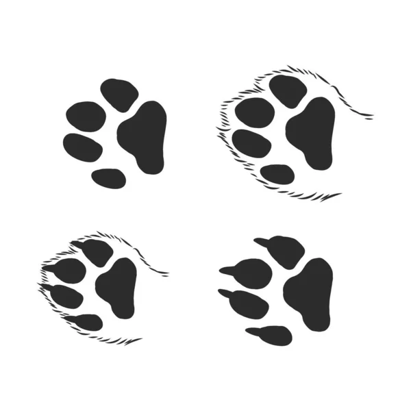 En uppsättning hundtassar. Svarta spår i olika stilar. Isolerad på vit bakgrund. Silhuetter av tassar. Vektorillustration. katt tass spår, vektor skiss illustration — Stock vektor