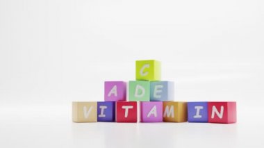 Kelime VITAMIN, renkli küplerle ilgili İ.Ö.Y. hapı, sağlık ve tıpla ilgili harflerle çocuk eğitim oyunu. Karikatür kulesi, beyaz arka planda dinamik topları ve küreleri olan bloklar piramidi