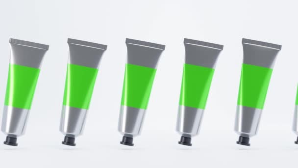 Set metal tubes with paints or hand cream. Aluminium packaging with blank chromakey label and black cap. Cosmetic product, glue, toothpaste, medical ointment on white background, 3d animation mock up. — Stock Video