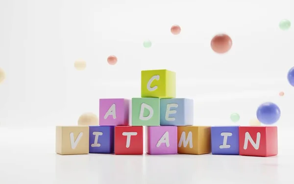 Word VITAMIN, piller A C D E på färgglada kuber, barn pedagogiska spel med bokstäver om hälsa och medicin. Tecknad torn, pyramid av block, bollar och sfärer på vit bakgrund, 3D-illustration — Stockfoto