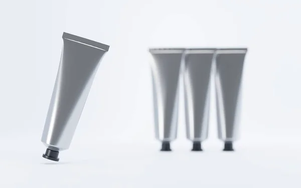 Metal tüpler el kremi ya da yağlı boya. Kozmetik alüminyum kutu modeli, diş macunu için boş gümüş ambalaj, yapıştırıcı ya da tıbbi ürün markalaştırma ve reklam için beyaz arka planda, 3d illüstrasyon