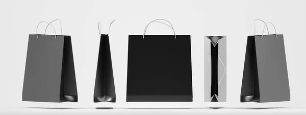 Bolsas de compras de papel negro frente, lado, parte superior y vista angular se burlan. Paquetes de regalo cuadrados en blanco con asas sobre fondo blanco aislado. Embalaje rectangular para diseño de identidad corporativa, set 3d — Foto de Stock