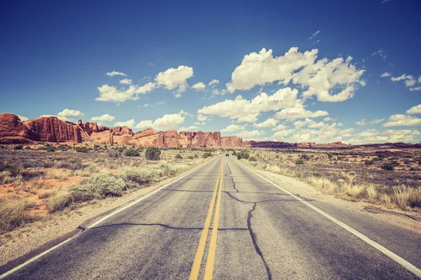 Vintage stylized scenic road, Arches National Park, USA — Stock Photo, Image