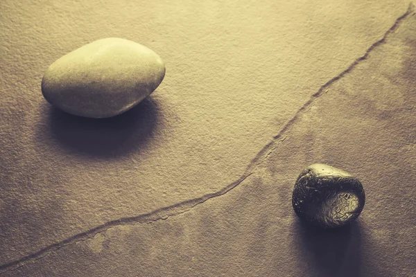 Retro stylized stones on a cracked slate — Stock Photo, Image