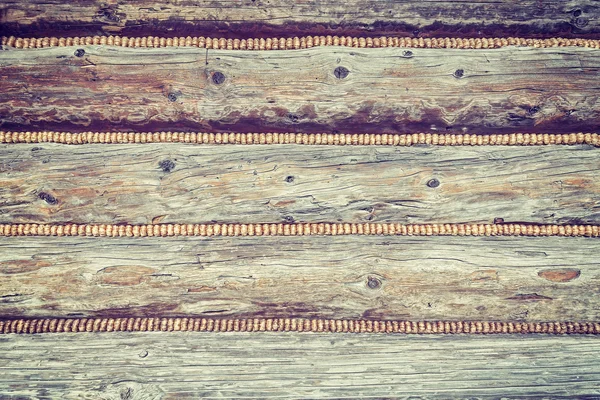 Vintage toned close up of a mountain cabin wooden wall. — Stock Photo, Image