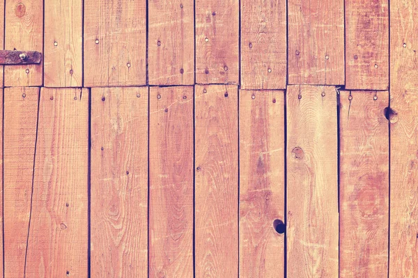 Vintage toned old wooden barn door background — Stock Photo, Image