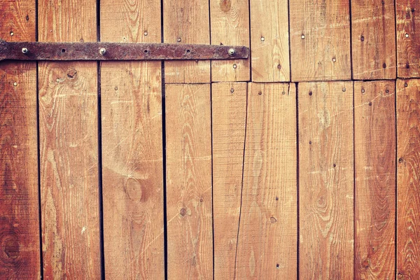 Старинный тонированный старый деревянный фон двери коровника — стоковое фото