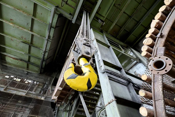 Crane hook in old abandoned coal mine. — Stock Photo, Image