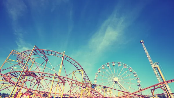 Vintage toned picture of an amusement park — Stock Photo, Image