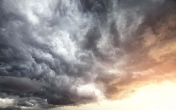 Stormy clouds at sunset, natural background — Stock Photo, Image