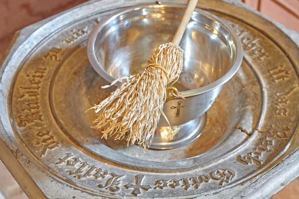 Baptismal font with sprinkler, shallow depth of field — Stock Photo, Image