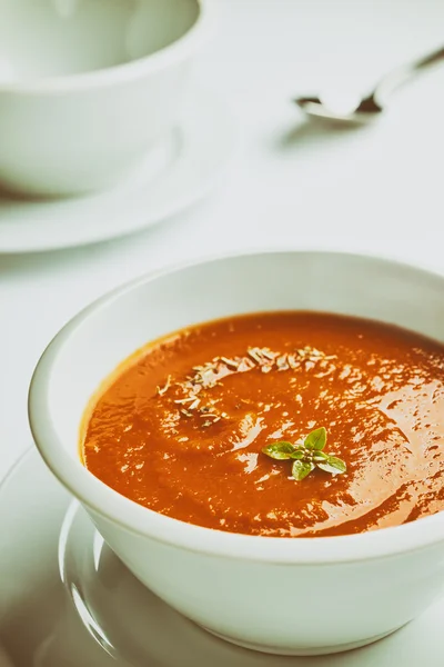 Retro stylized white bowl with tomato soup. — Stock Photo, Image