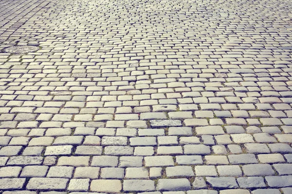 Vintage toned cobblestone street. — Stock Photo, Image