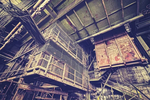 Vintage toned abandoned industrial interior. — Stock Photo, Image