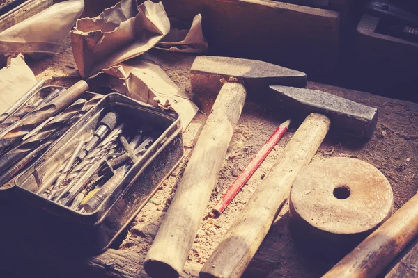 Retro toned old tools on wooden table in joinery. — Stock Photo, Image