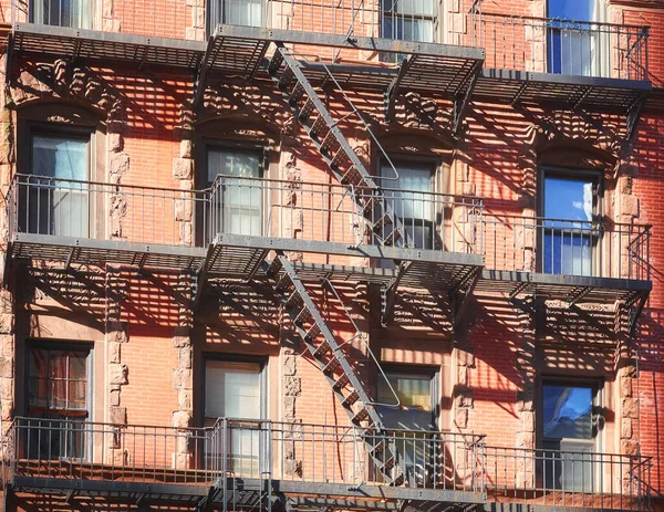 Old building with iron fire escape, New York City, USA.