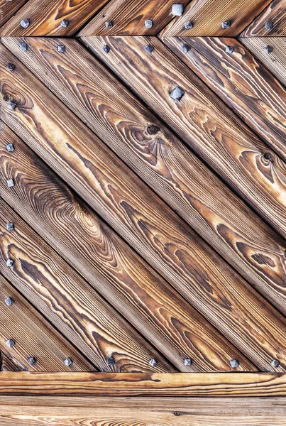 Wooden background with metal rivets, old gate of castle. — Stock Photo, Image