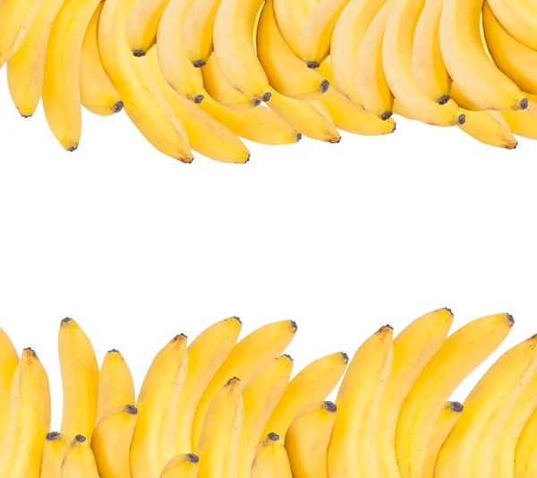 Fundo feito de bananas maduras isoladas em branco . — Fotografia de Stock