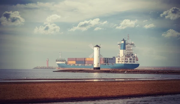 Retro style picture of windmill and ship leaving port. — Stock Photo, Image