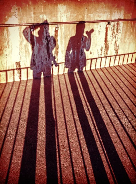 Concept picture of people with cameras shadows. — Stock Photo, Image